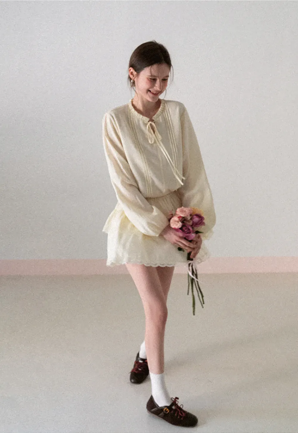 Shirt with ruffled collar and tie front layered skirt