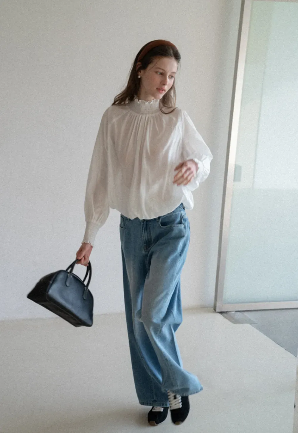 Elegant High Neck Blouse with Ruffled Cuffs and Hem