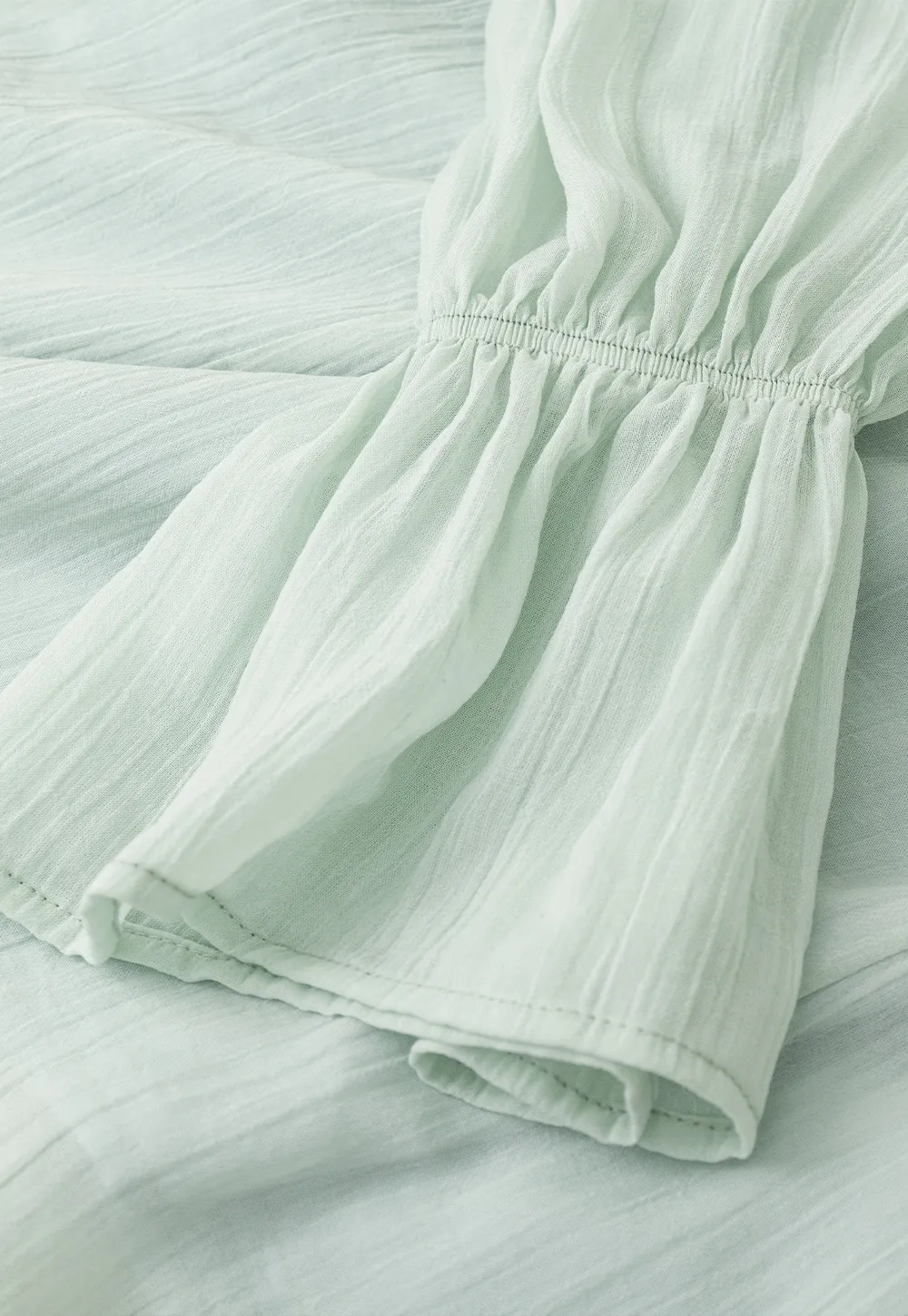 Off Shoulder Blouse with Ruffled Layers and Floral Embellishment