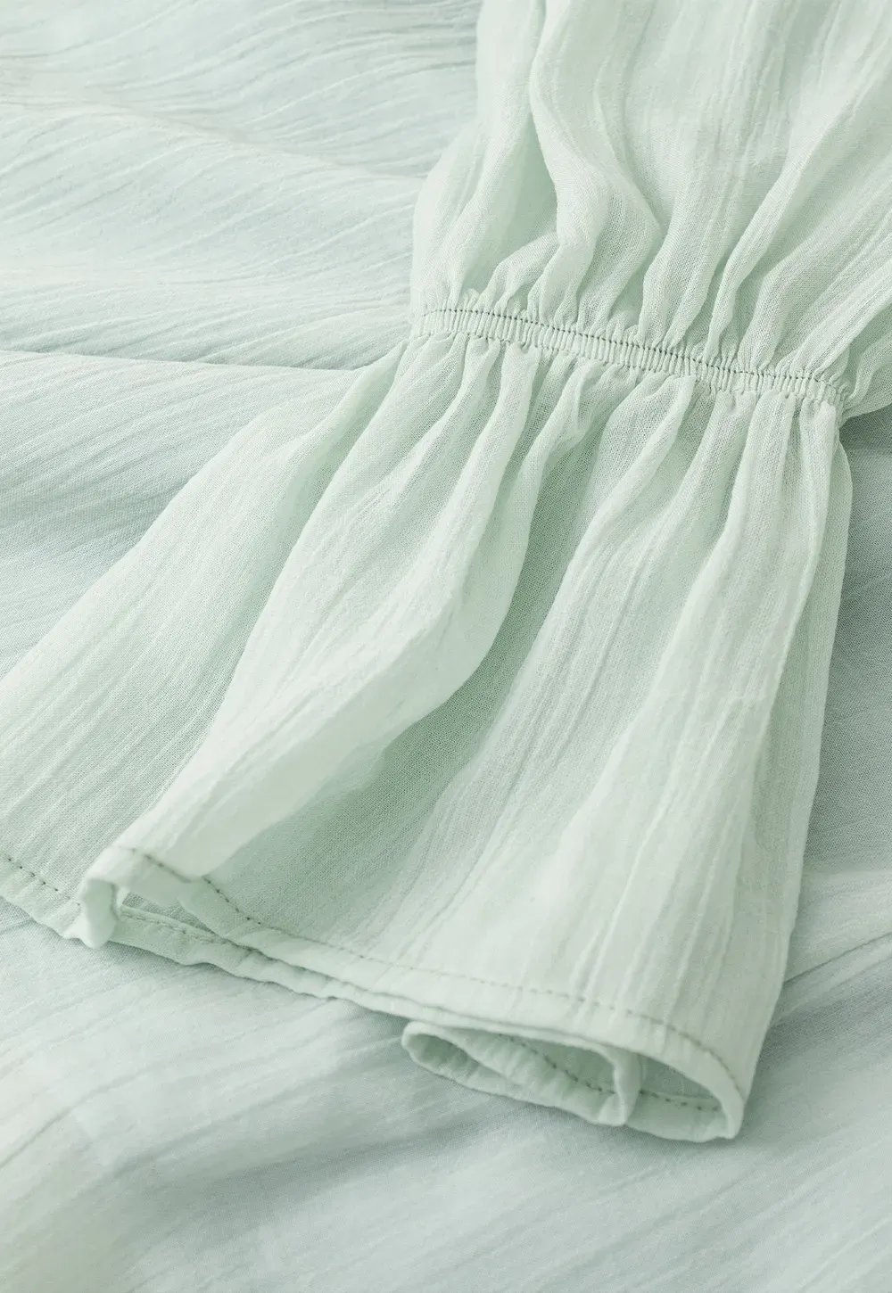 Off Shoulder Blouse with Ruffled Layers and Floral Embellishment