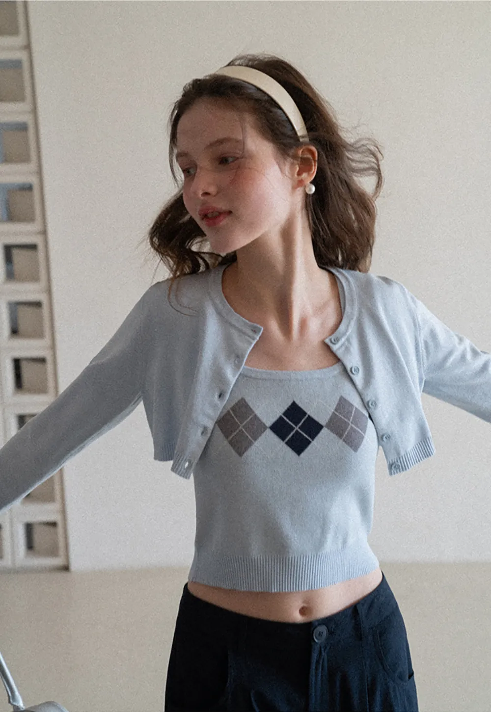 Woolen knit sweater with argyle pattern and buttons