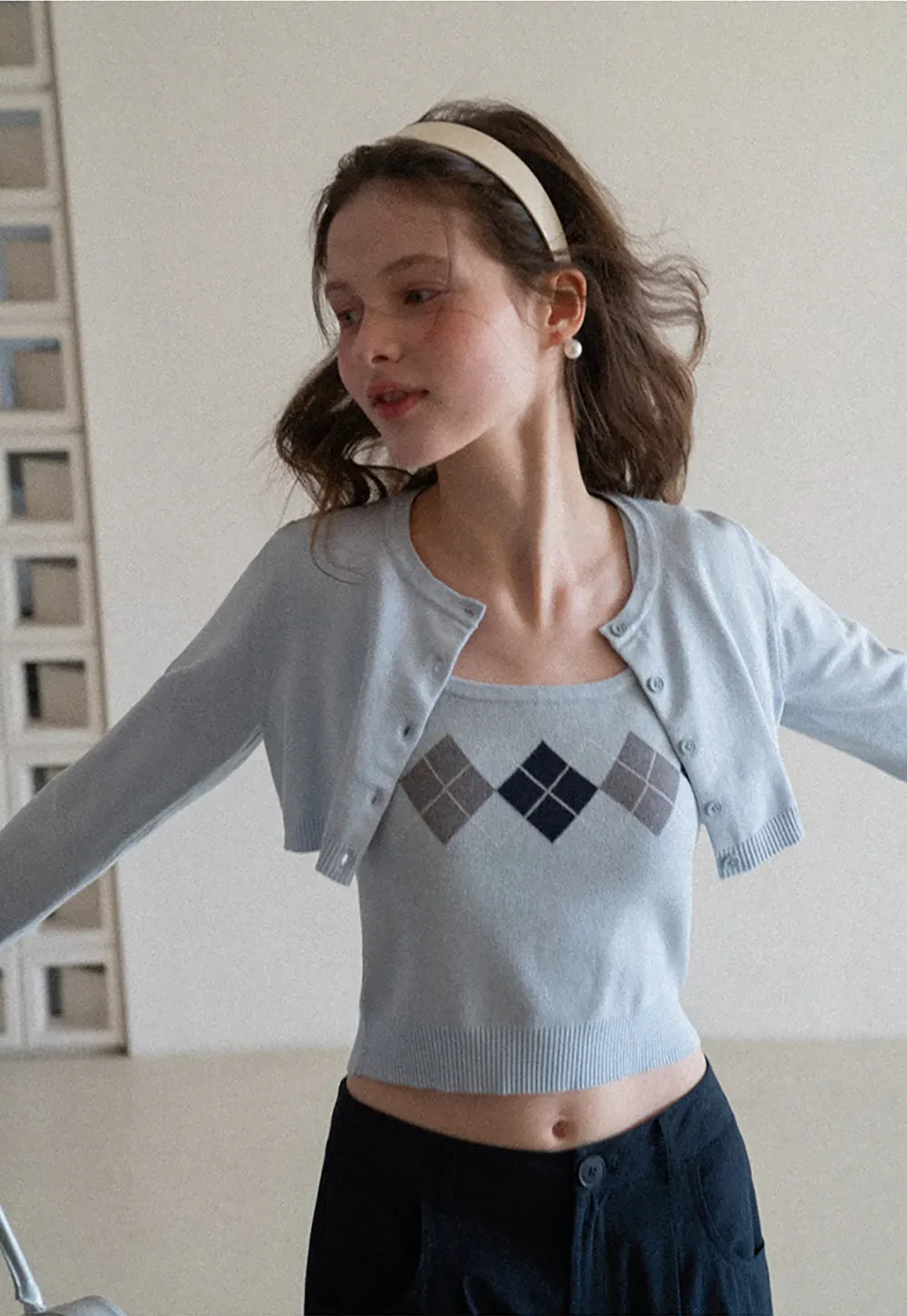 Woolen knit sweater with argyle pattern and buttons