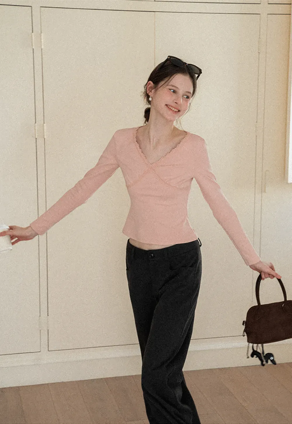 V neck long sleeve top with lace trim and fitted design