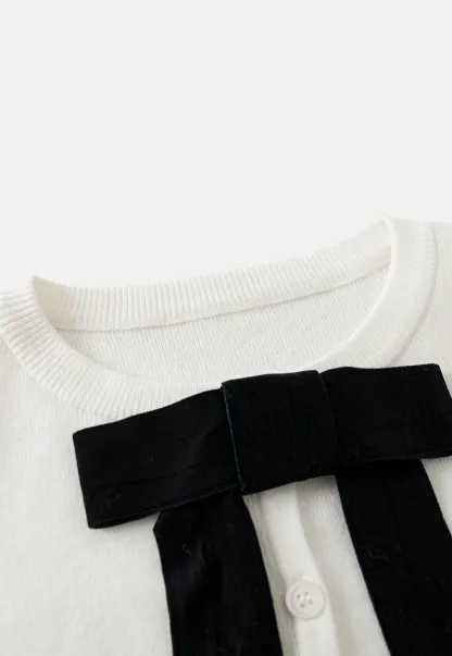 Chic White Cardigan with Bow Tie and Matching Camisole