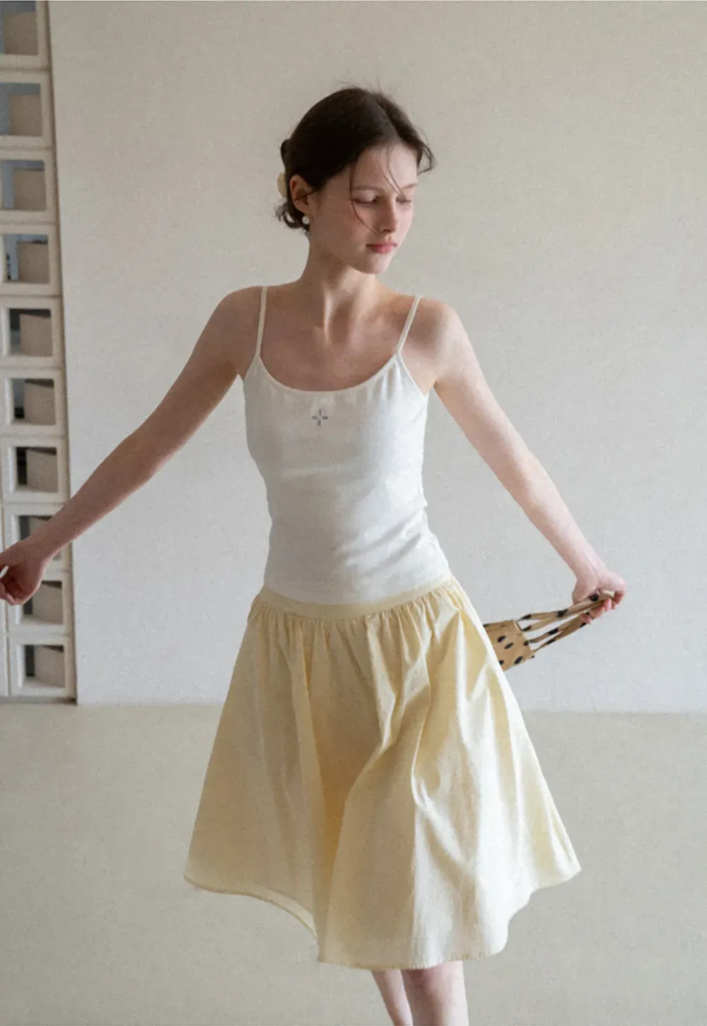 Gray tank top with small embroidered cross detail