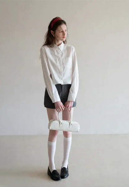 Long sleeve button front shirt with scalloped hem