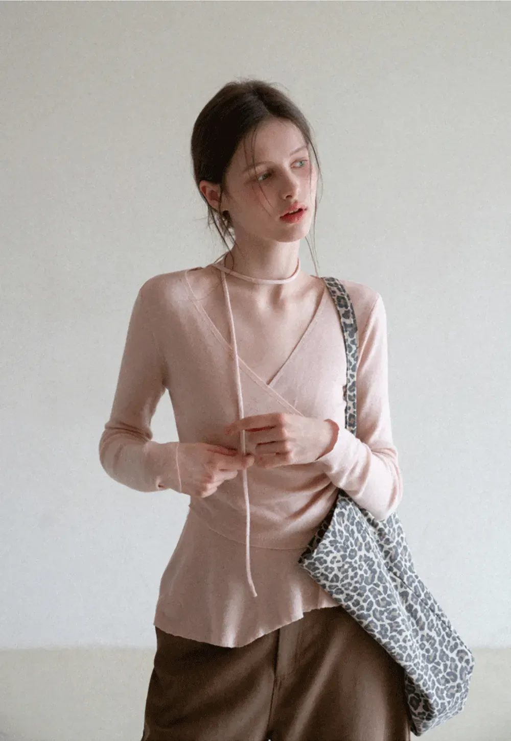 Long sleeve wrap knit sweater with ruched detail