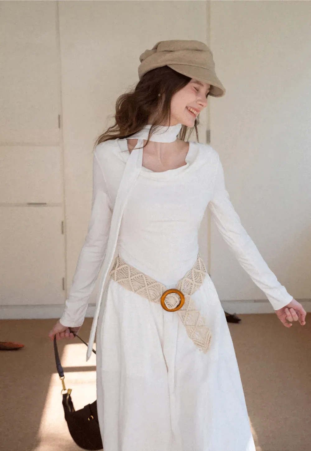 Elegant asymmetrical long sleeve dress with unique belt design