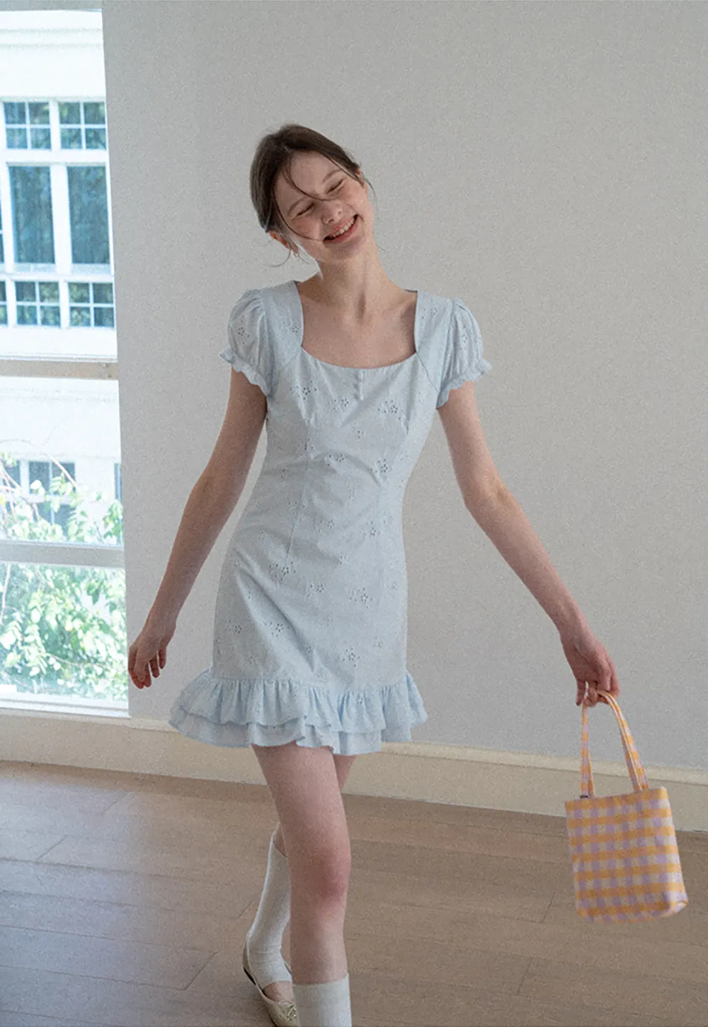 Eyelet dress with puff sleeves and ruffled hem