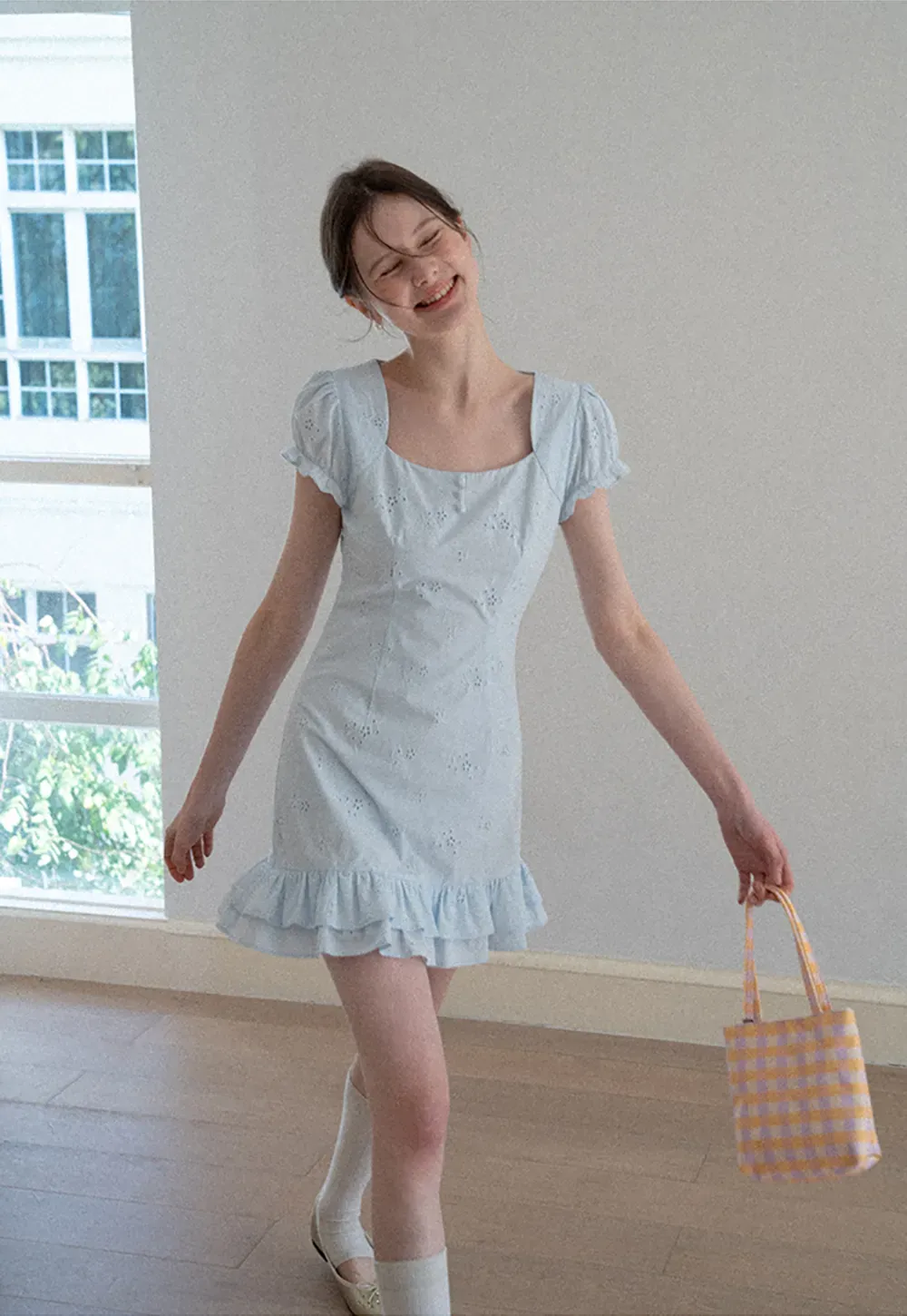 Eyelet dress with puff sleeves and ruffled hem