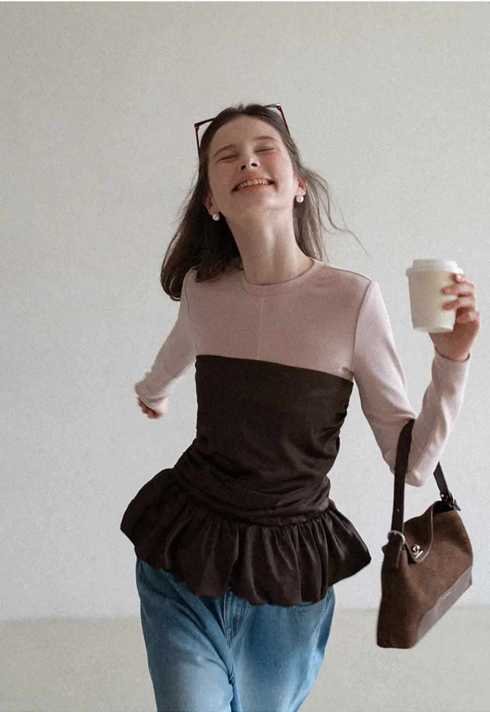 Long sleeve top with ruffled hem and layered design