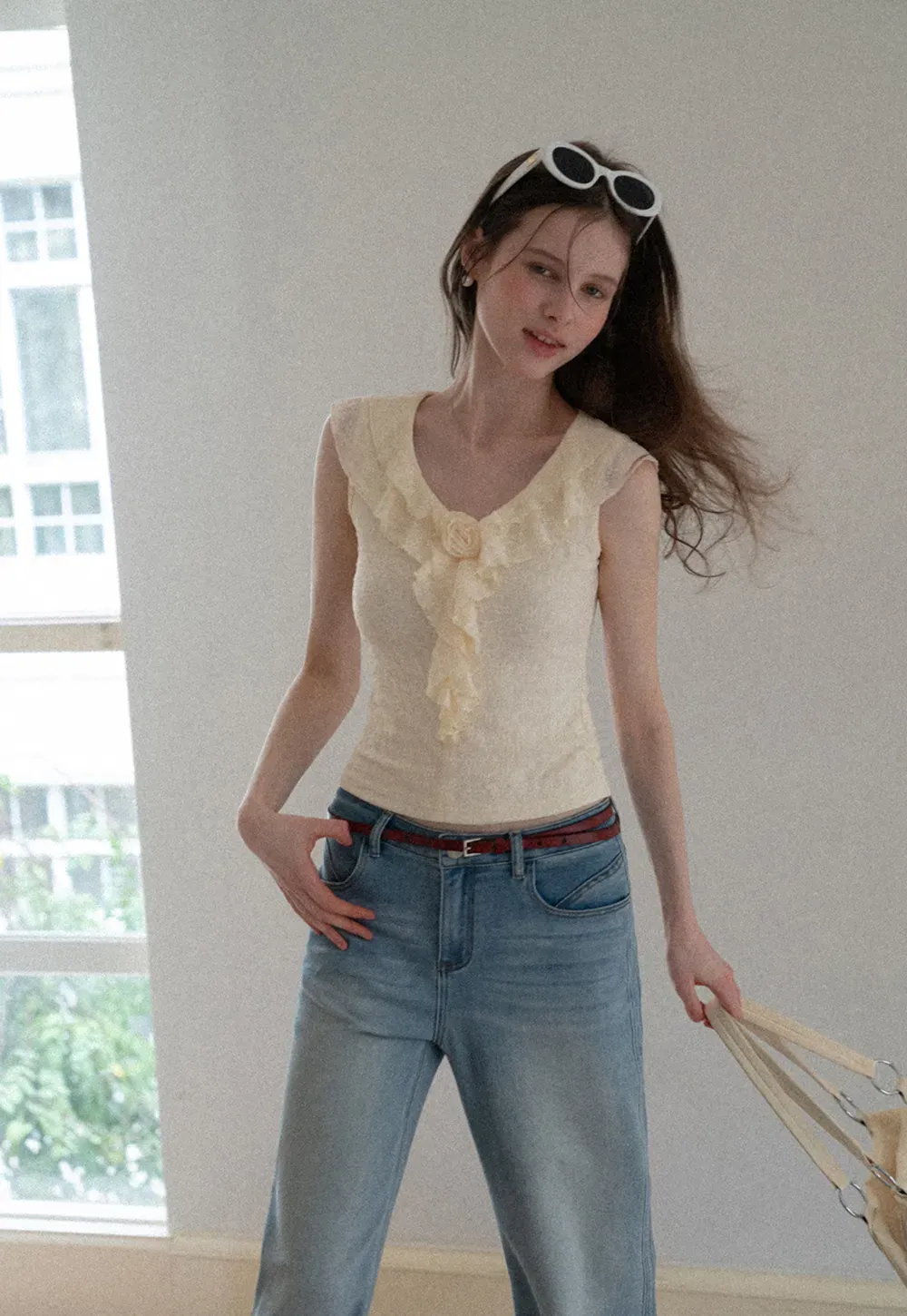 Sleeveless Top with Ruffled V Neck and Floral Detail