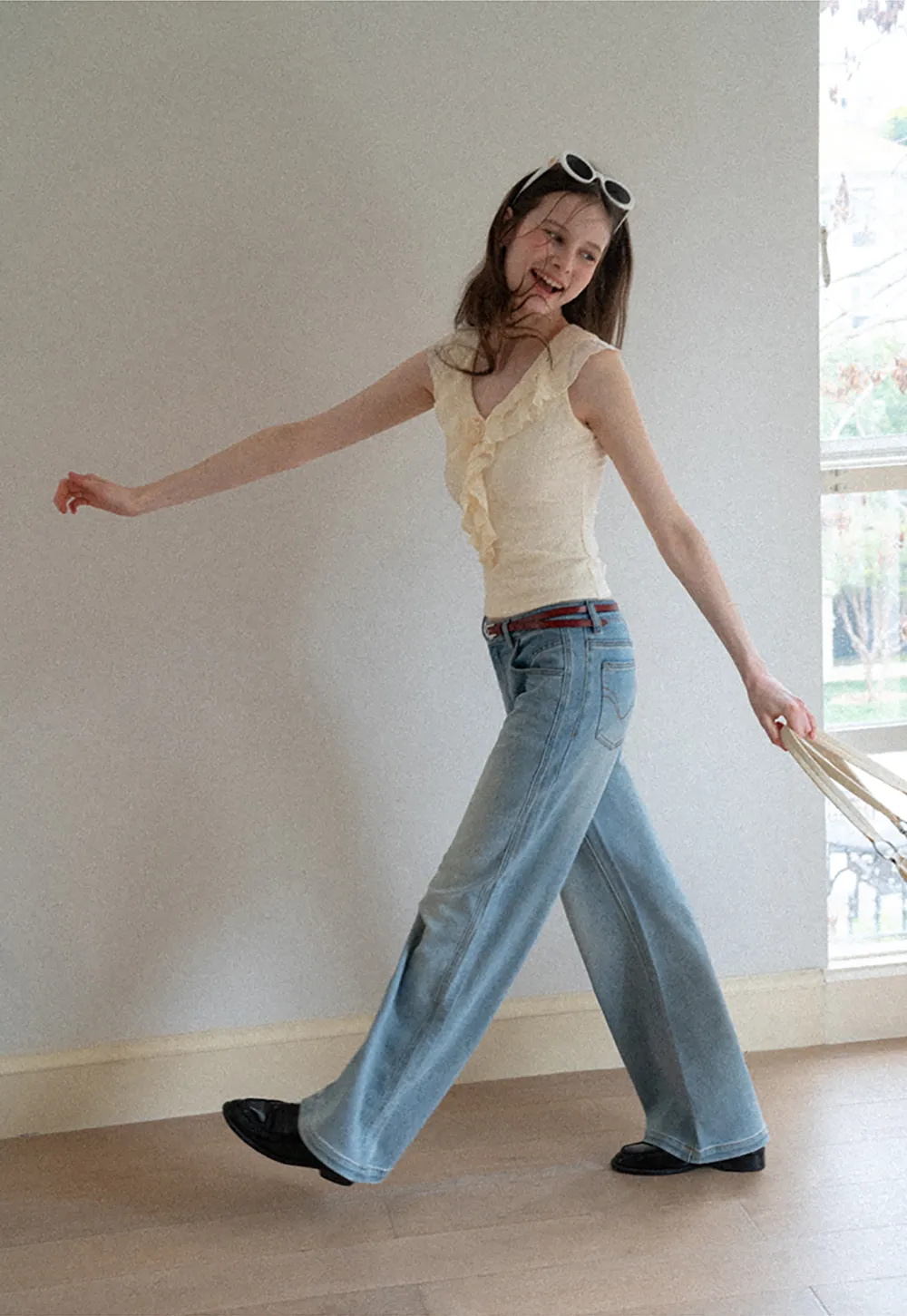 Sleeveless Top with Ruffled V Neck and Floral Detail