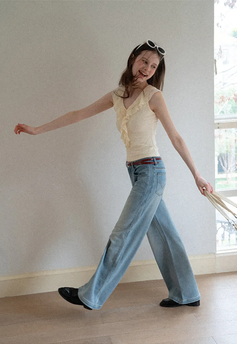 Sleeveless Top with Ruffled V Neck and Floral Detail