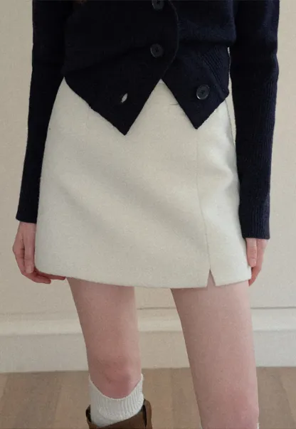 A-line mini skirt with textured fabric and central seam design