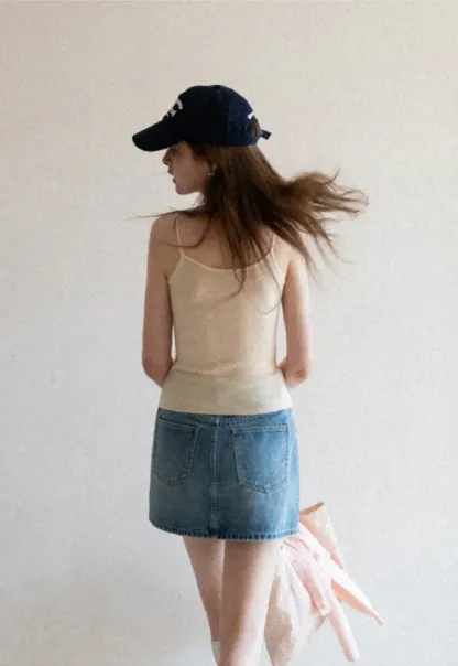 Silk-like tank top with thin straps and draped neckline