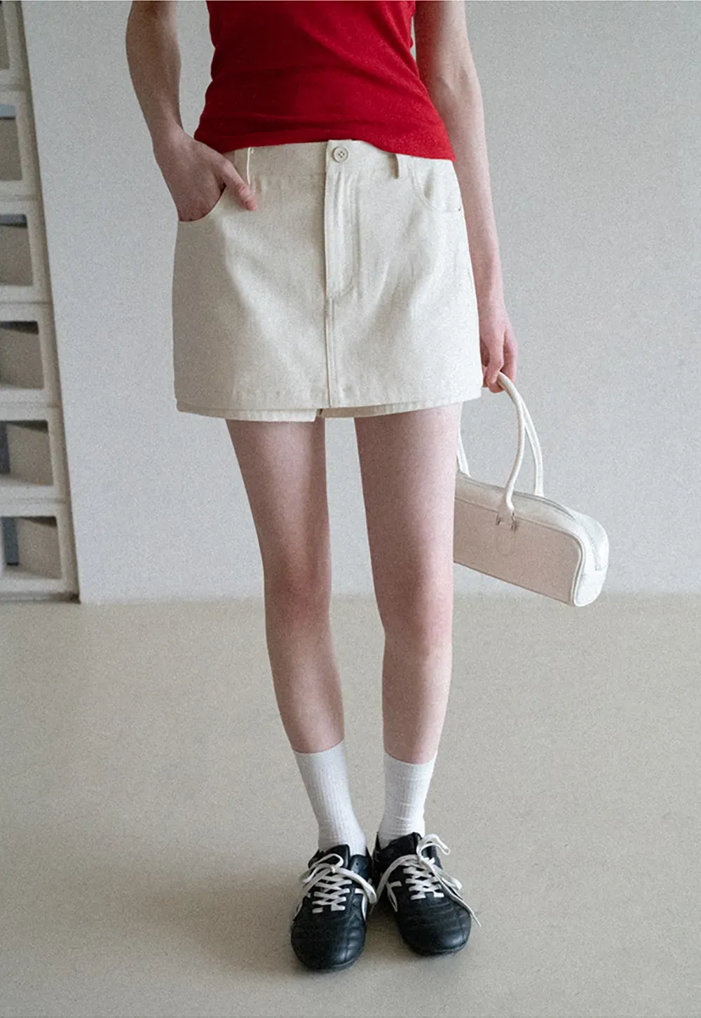 High waist pleated mini skirt with button front design