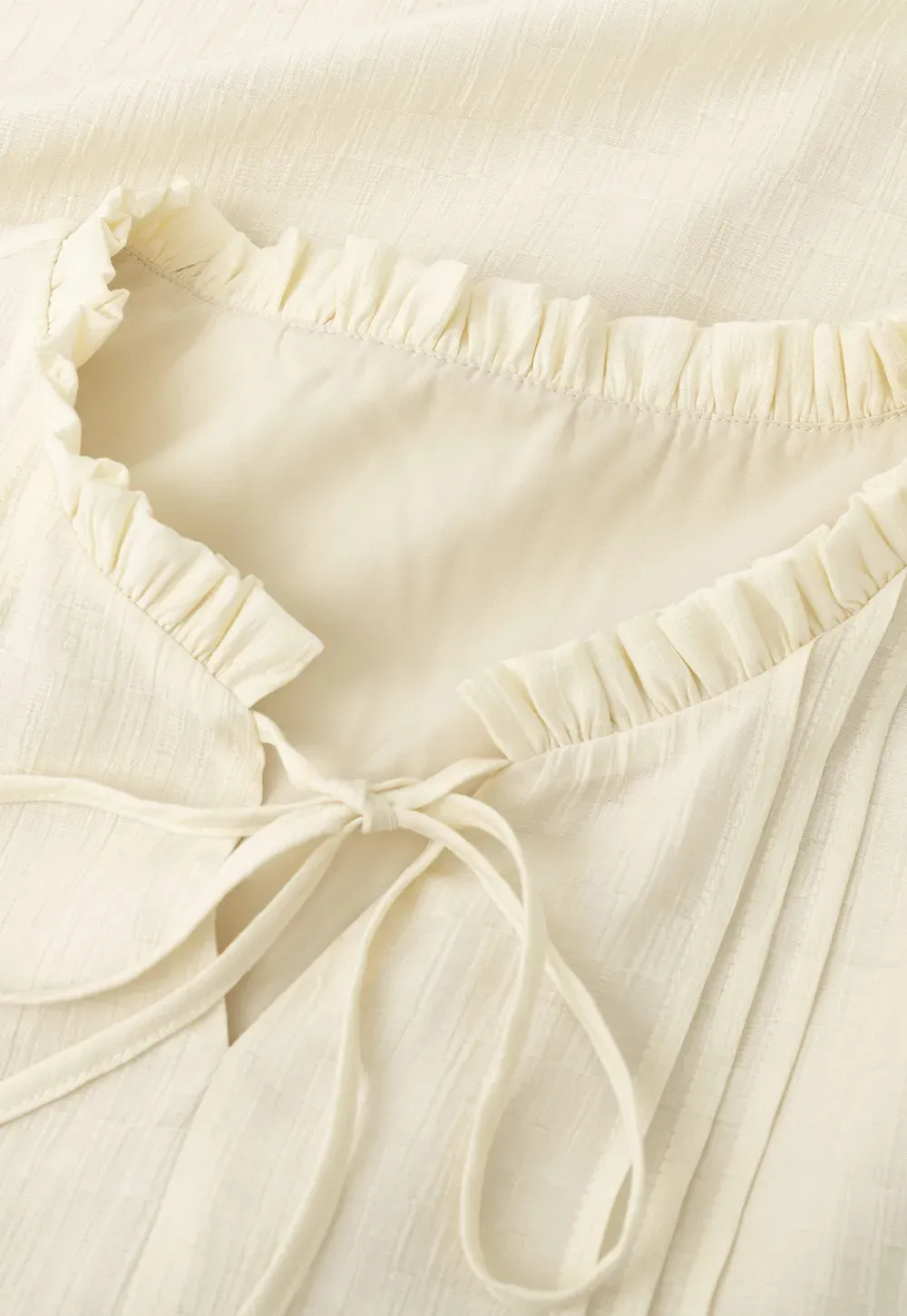 Shirt with ruffled collar and tie front layered skirt