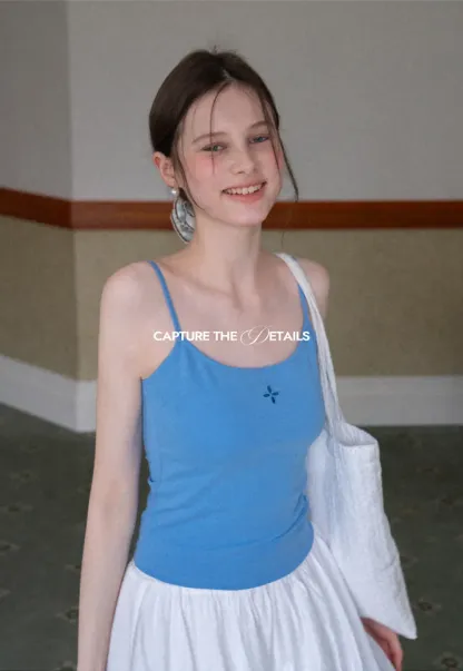 Gray tank top with small embroidered cross detail