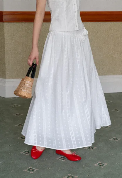 Halter neck sleeveless top with buttons and pleated skirt