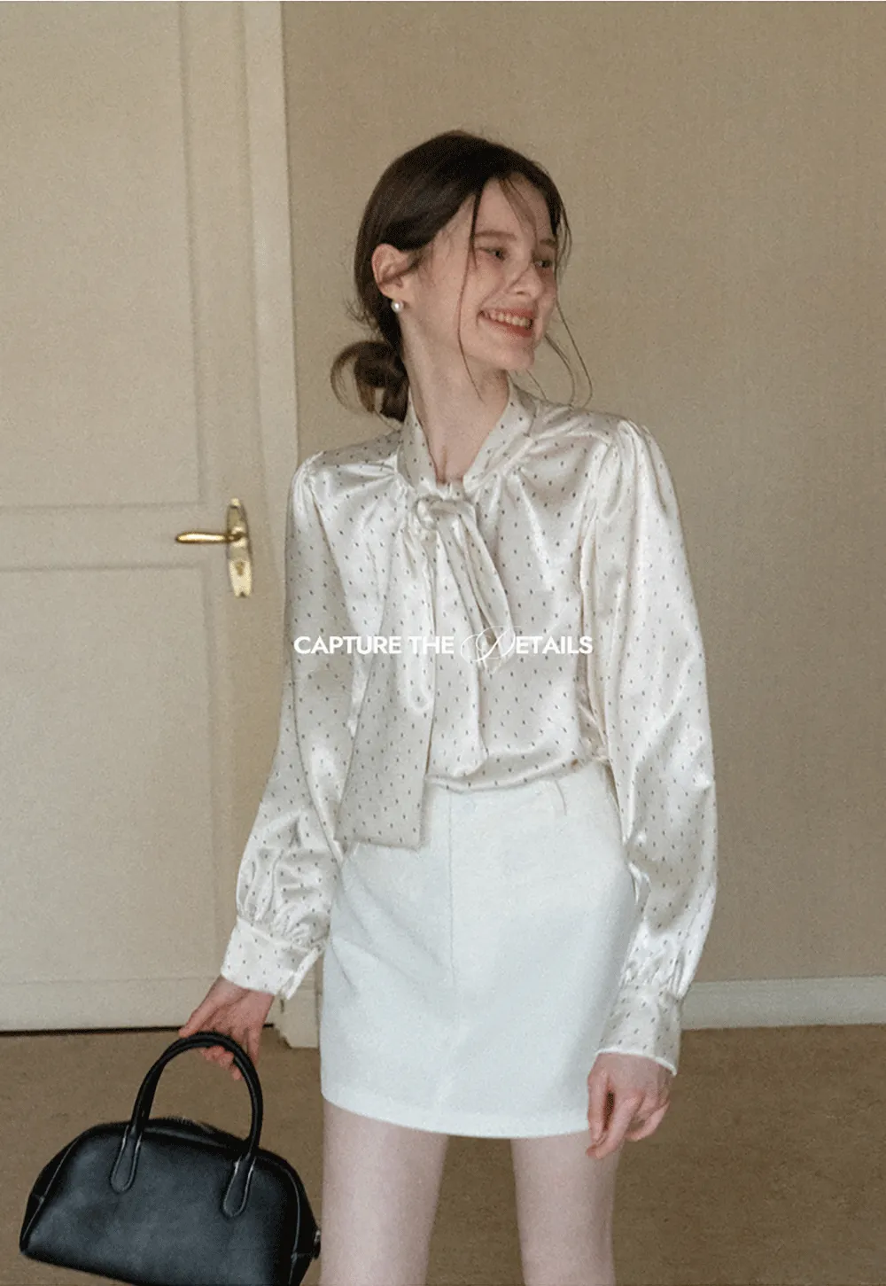 Elegant blouse with bow collar and long sleeves