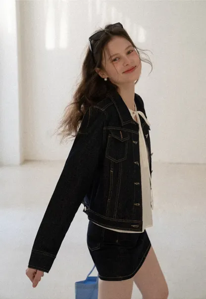 A-line denim skirt with front pocket design and adjustable waistband.