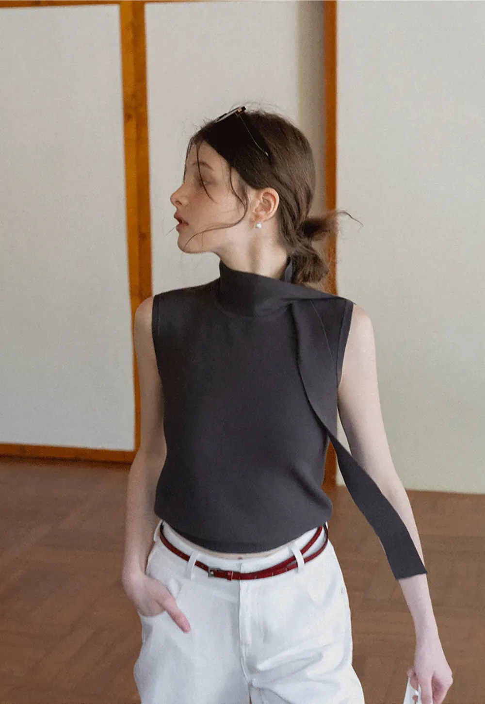 Sleeveless high neck knit top with side tie detail