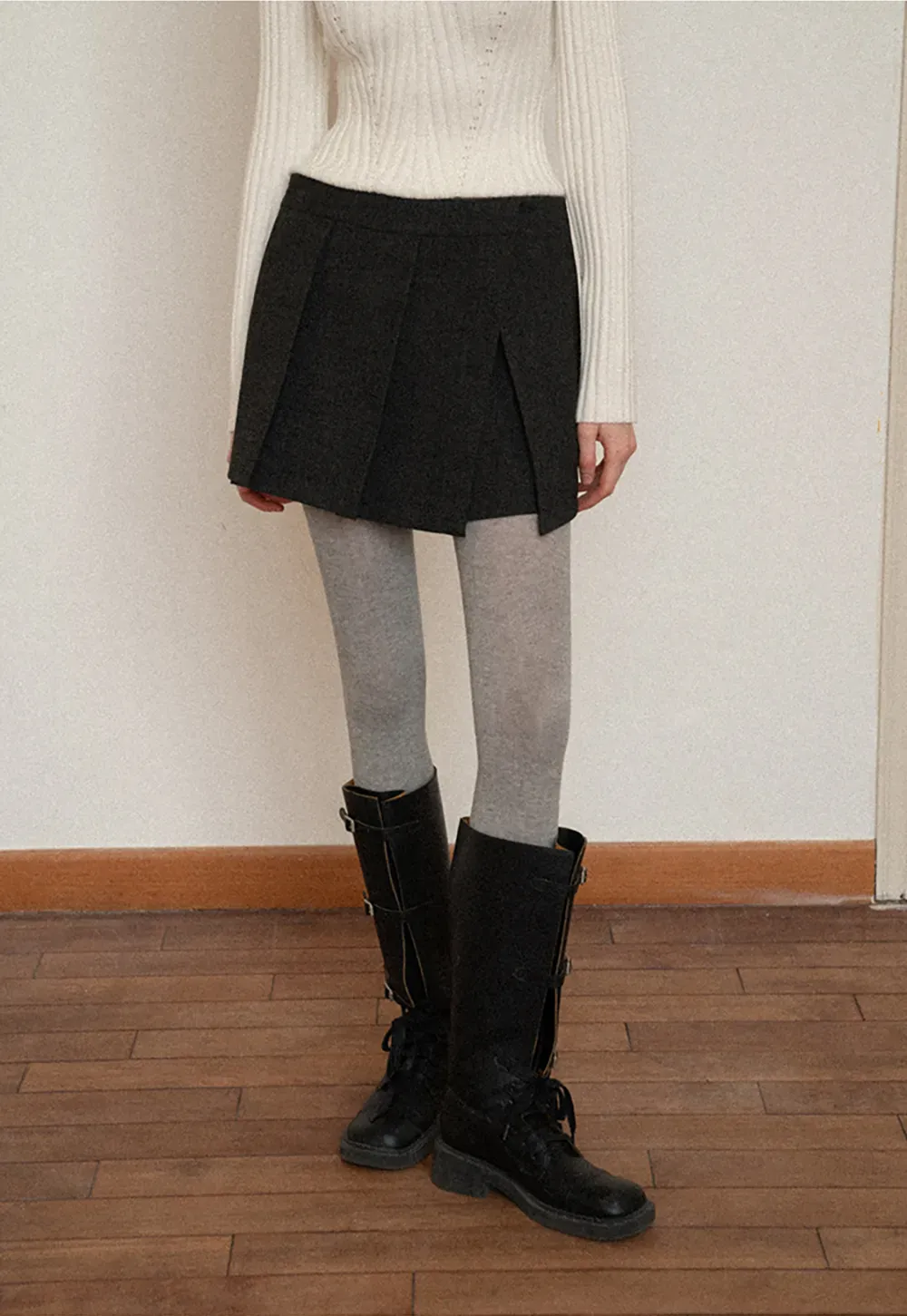 Elegant Pleated Mini Skirt with Tights and Boots Combo
