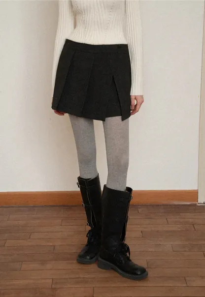 Elegant Pleated Mini Skirt with Tights and Boots Combo