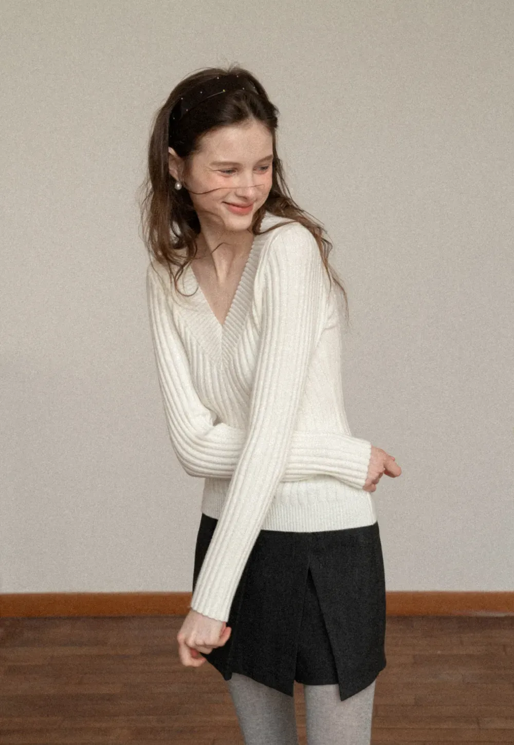 Elegant Ribbed Knit Sweater with V-Neck Design