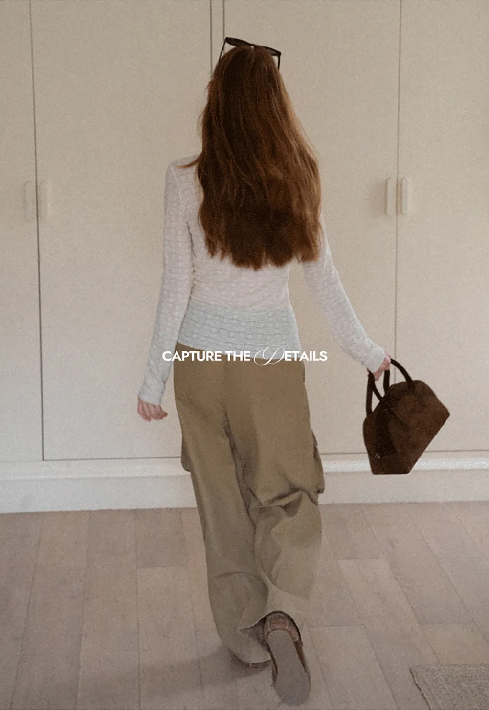 Elegant textured long sleeve top with subtle pattern design