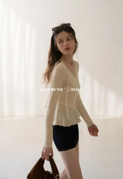 Long sleeve wrap knit sweater with ruched detail