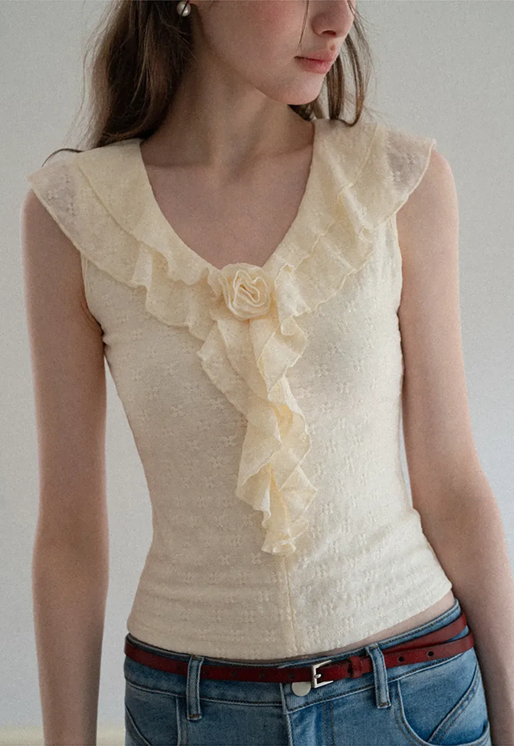 Sleeveless Top with Ruffled V Neck and Floral Detail