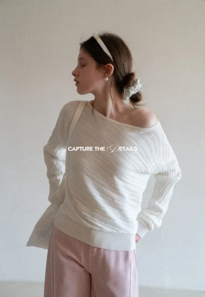 Ribbed knit sweater with wide neckline and long sleeves