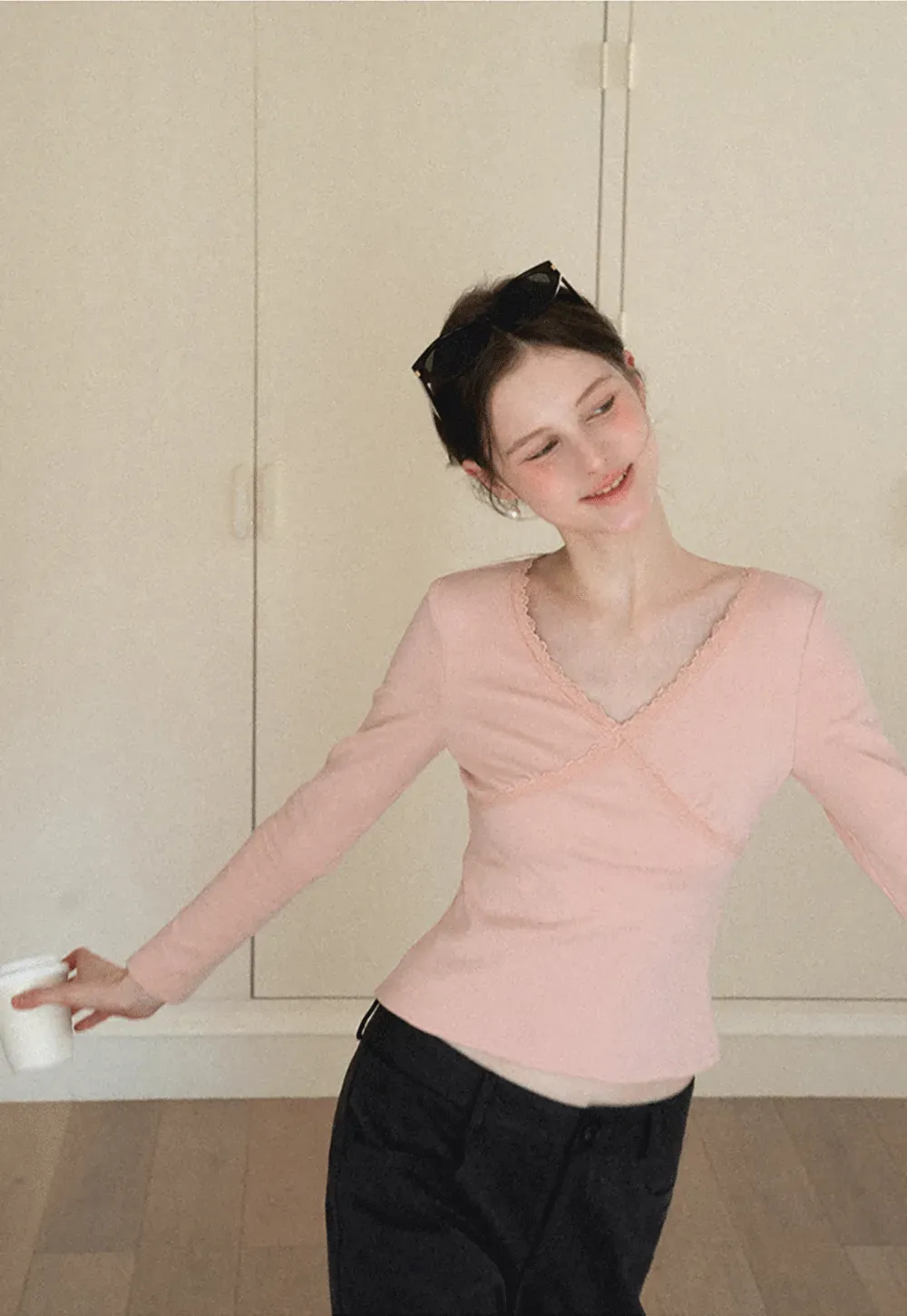 V neck long sleeve top with lace trim and fitted design