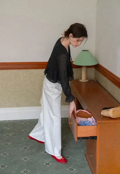 Polka Dot Sheer Blouse with Ruffled Hem and Tie Neck