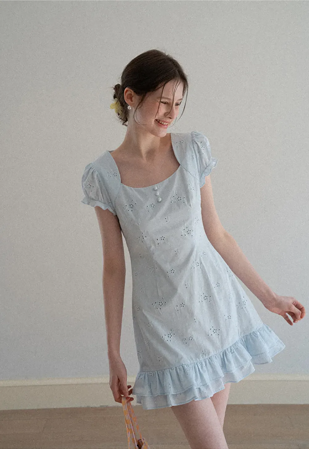 Eyelet dress with puff sleeves and ruffled hem