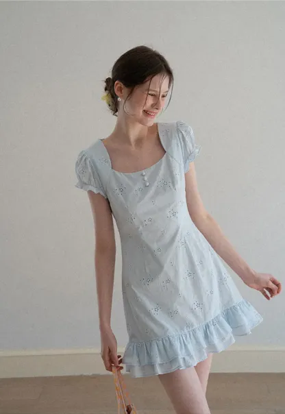 Eyelet dress with puff sleeves and ruffled hem