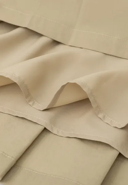 Pleated skirt with side tie waistband