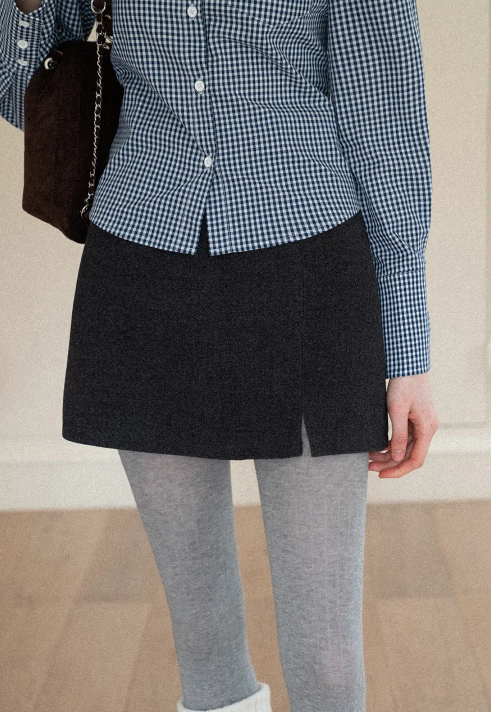 Elegant Mini Skirt with Front Slit and Button Detail