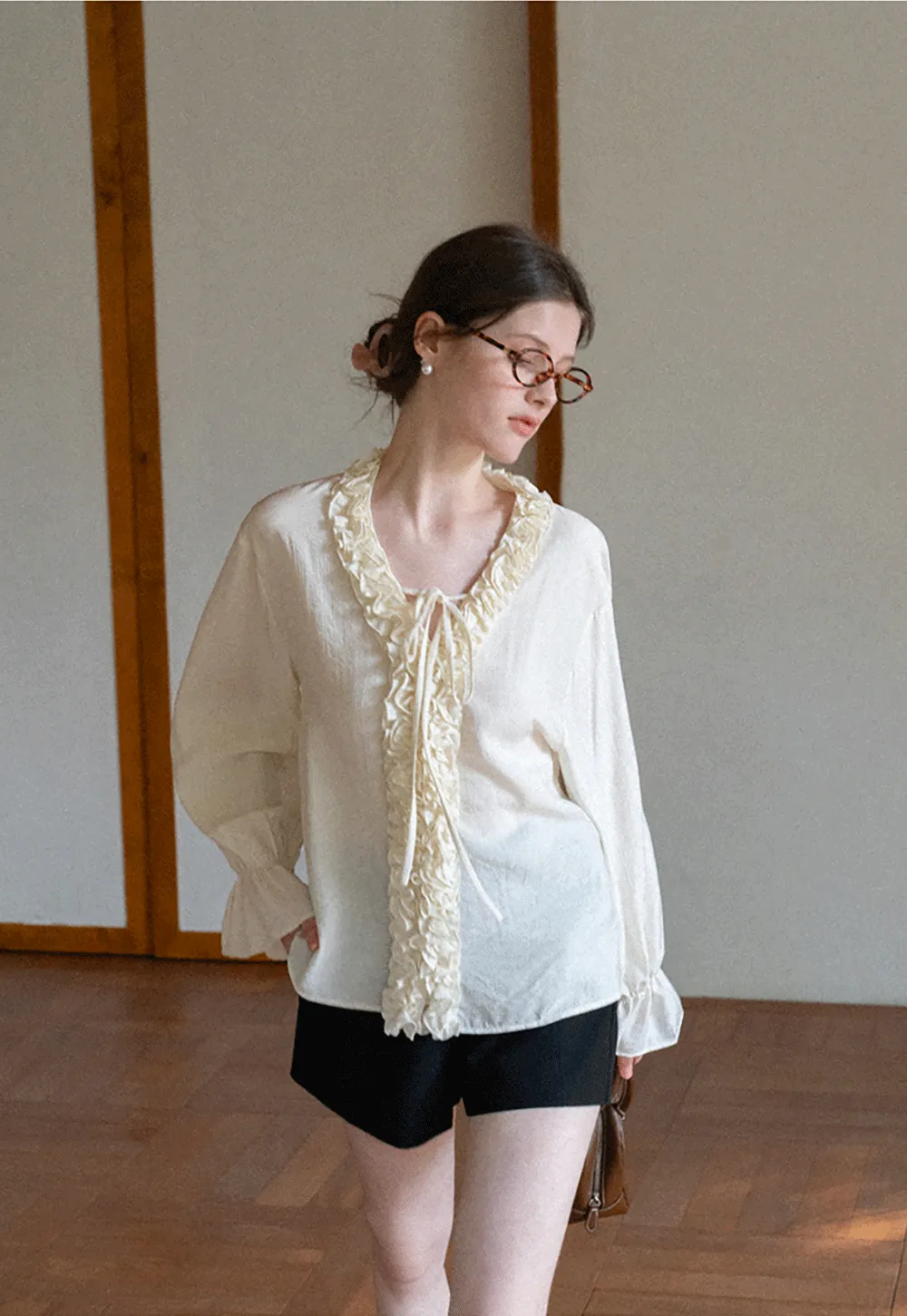 Long sleeve shirt with ruffled neckline and gathered cuffs