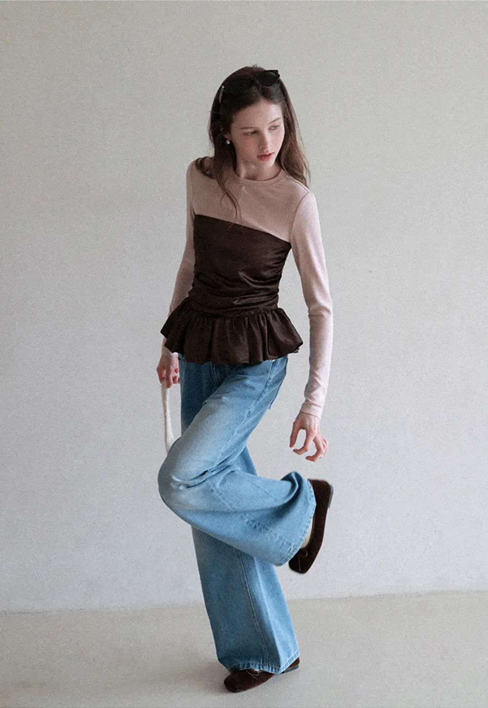 Long sleeve top with ruffled hem and layered design