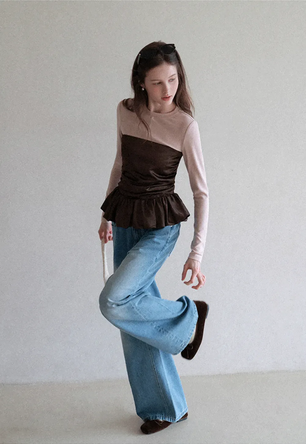 Long sleeve top with ruffled hem and layered design