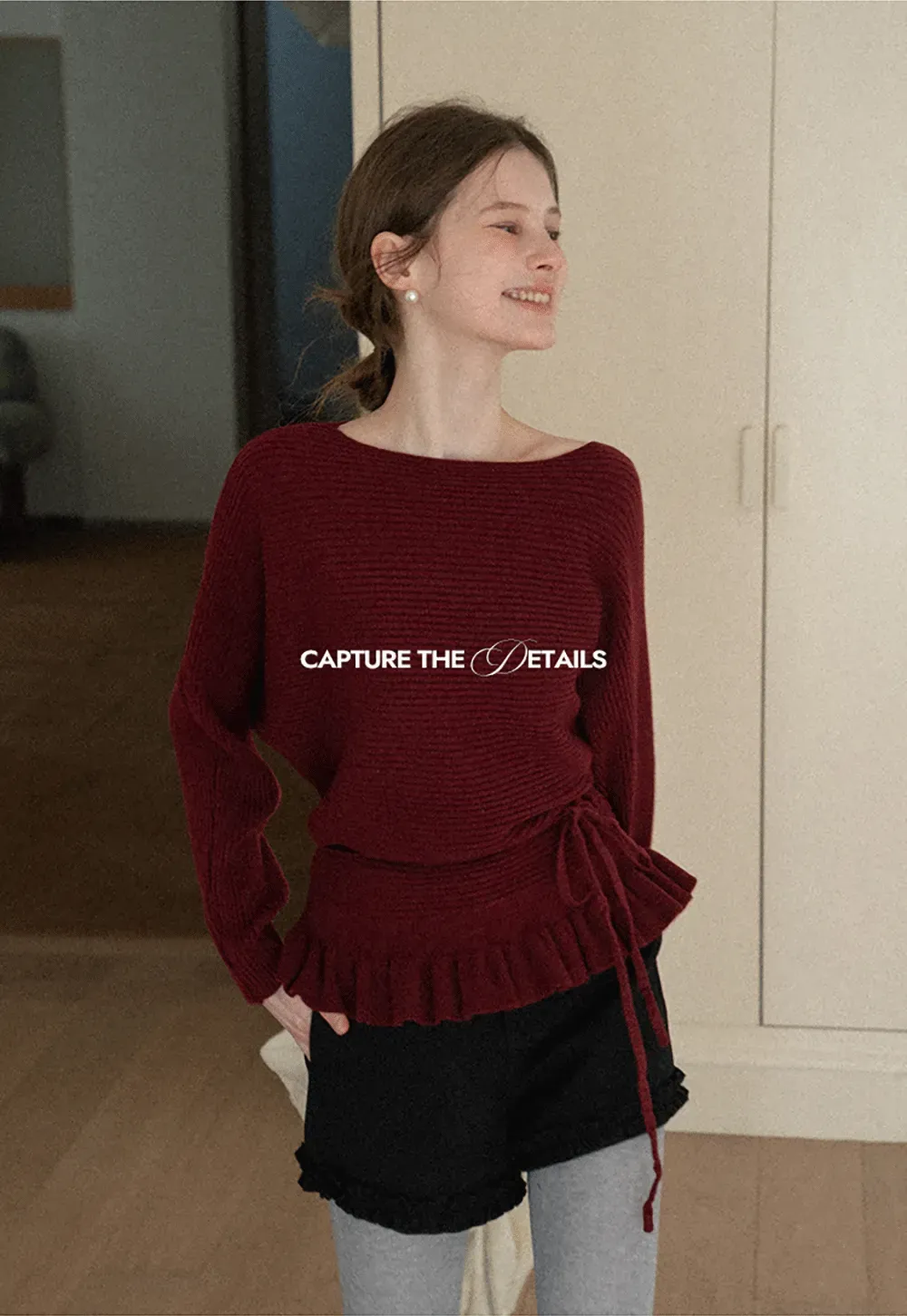 Ribbed knit sweater with tie back and flared hem design