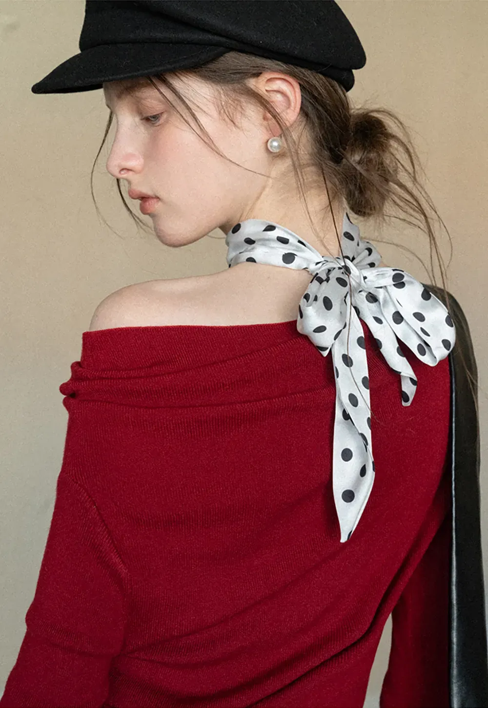 Elegant polka dot neck tie with bow design for women's fashion.