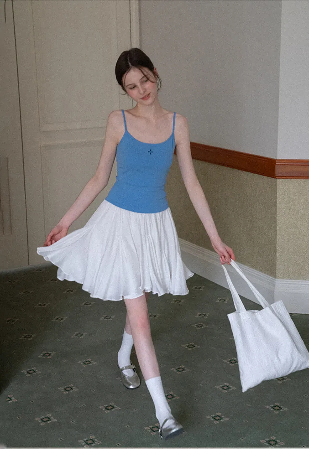 Gray tank top with small embroidered cross detail