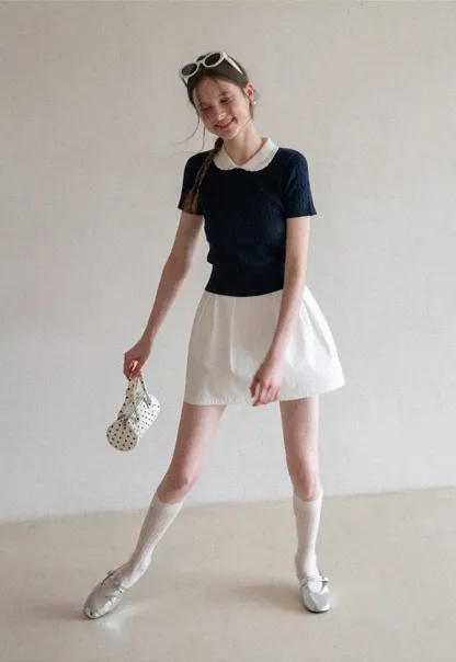 Plaid skirt with pleats and ruffled top