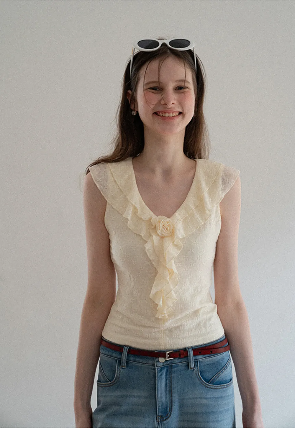 Sleeveless Top with Ruffled V Neck and Floral Detail