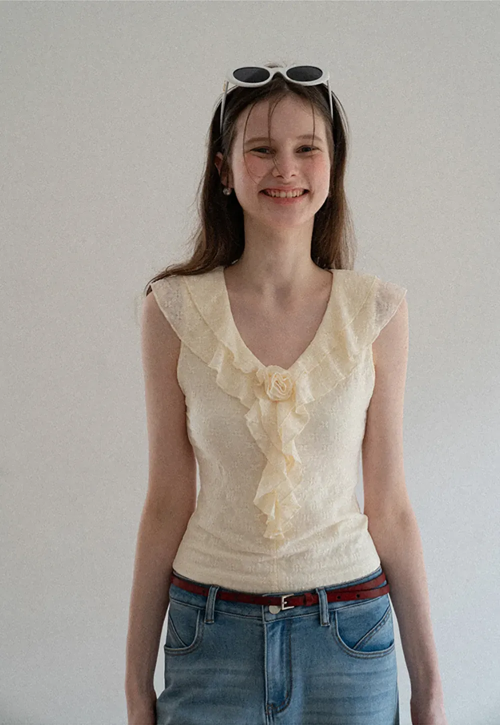 Sleeveless Top with Ruffled V Neck and Floral Detail