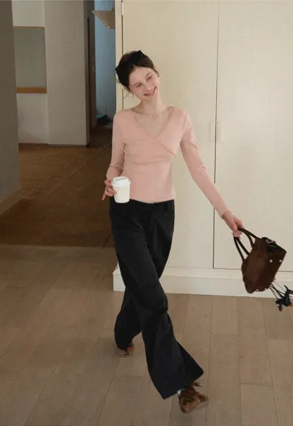 V neck long sleeve top with lace trim and fitted design